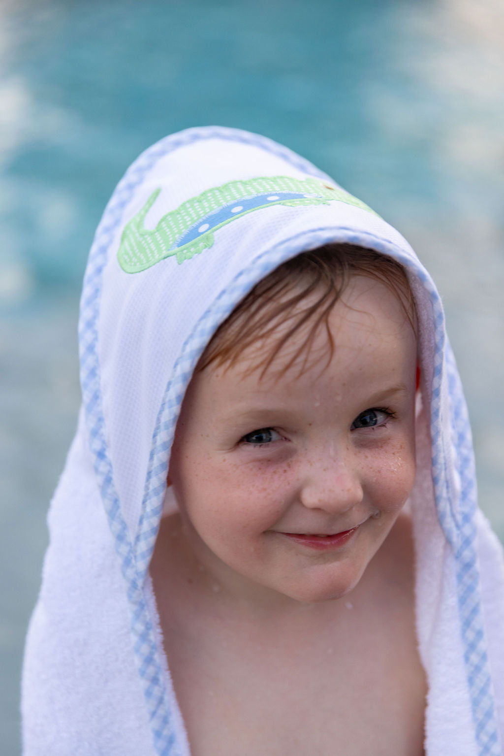Cotton terry hooded towel for baby to toddlers with a green gingham check and blue dot alligator applique on the hood, 3 Marthas