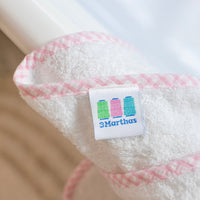 3 Marthas white terrycloth towel with pink check trim close up.