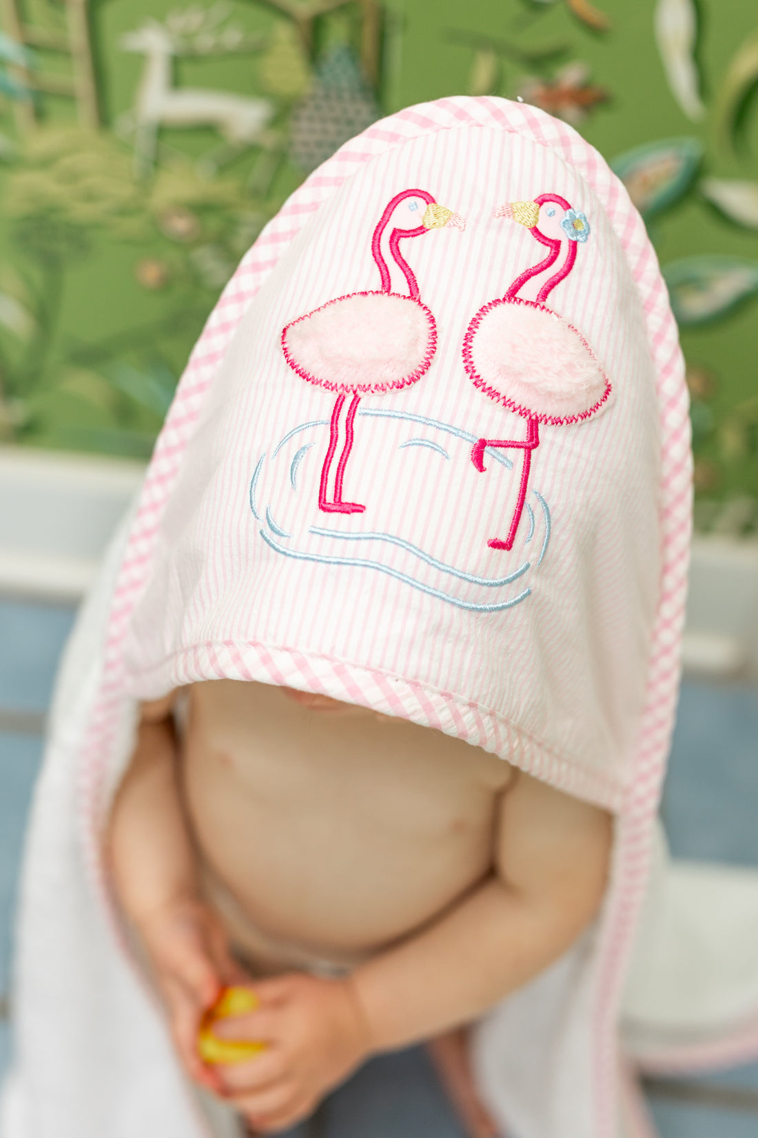 Baby in hooded towel with pink flamingo, 3 Marthas