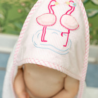 Baby in hooded towel with pink flamingo, 3 Marthas