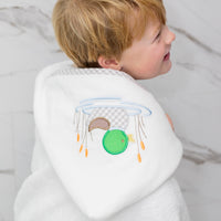 Child wrapped in mallard hooded towel, 3 Marthas