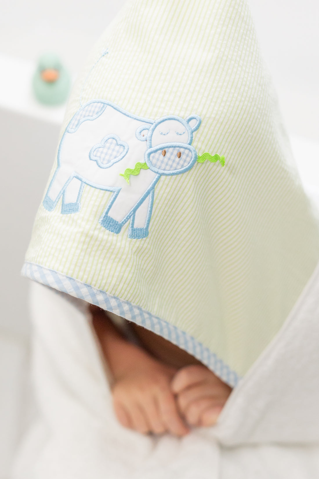 Hooded towel for children featuring a blue cow applique, 3 Marthas