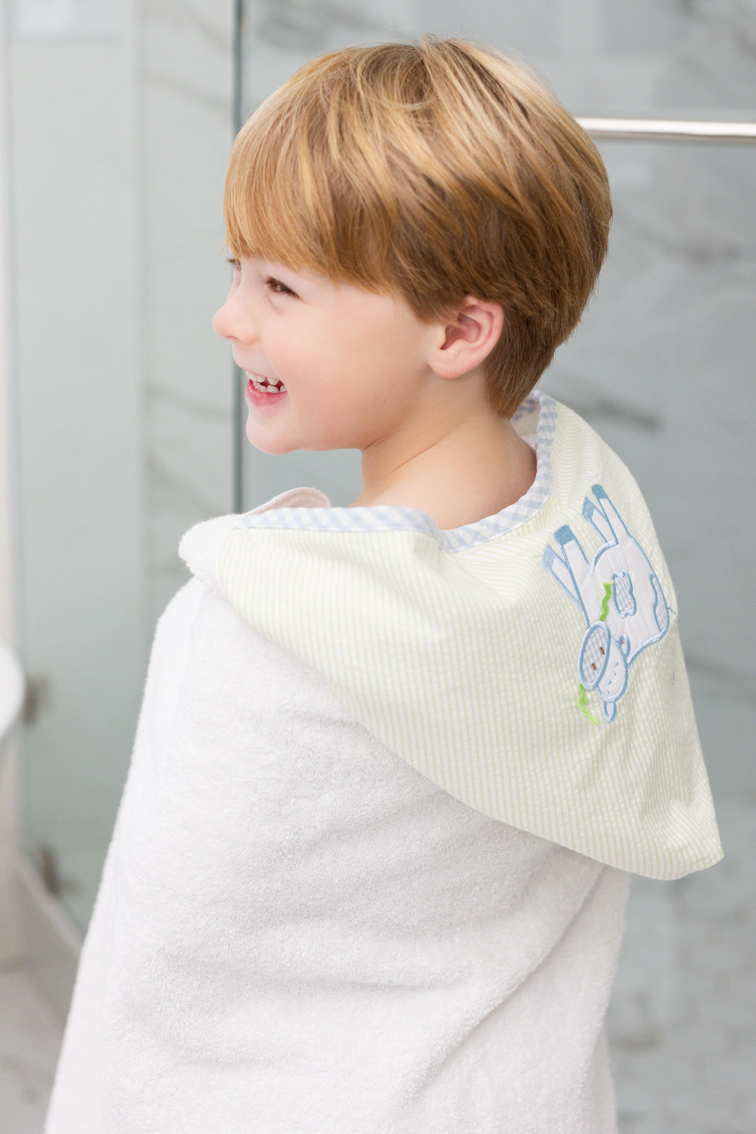 Hooded towel for children featuring a blue cow applique, 3 Marthas
