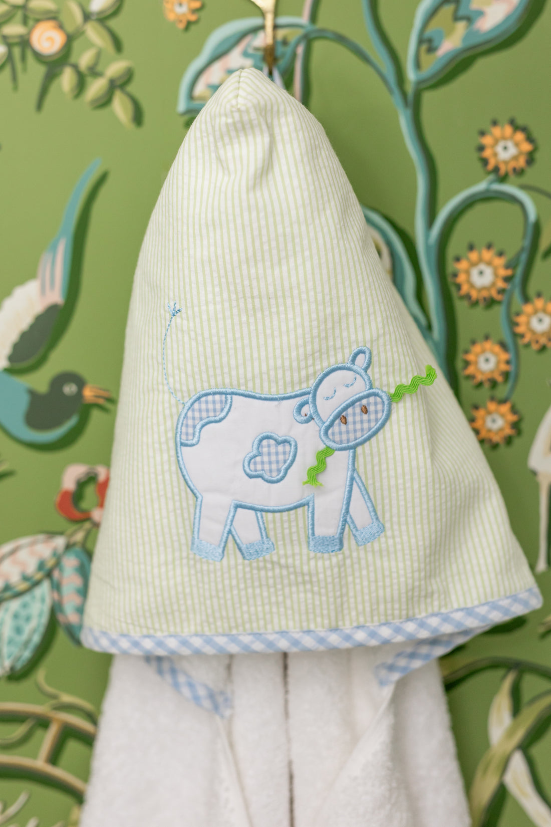 Hanging hooded towel for children featuring a blue cow applique, 3 Marthas