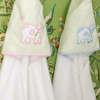 Handing hooded towels for children featuring blue and pink cow applique, 3 Marthas