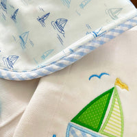 Cotton bib for baby boy with blue sailboat print fabric and blue gingham check trim and burp cloth with green sailboat applique, 3 Marthas