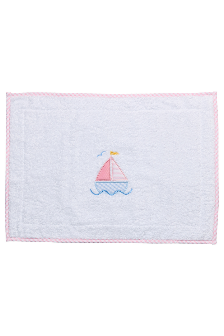 White terry bathmat with pink sailboat applique and gingham trim
