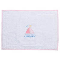 White terry bathmat with pink sailboat applique and gingham trim
