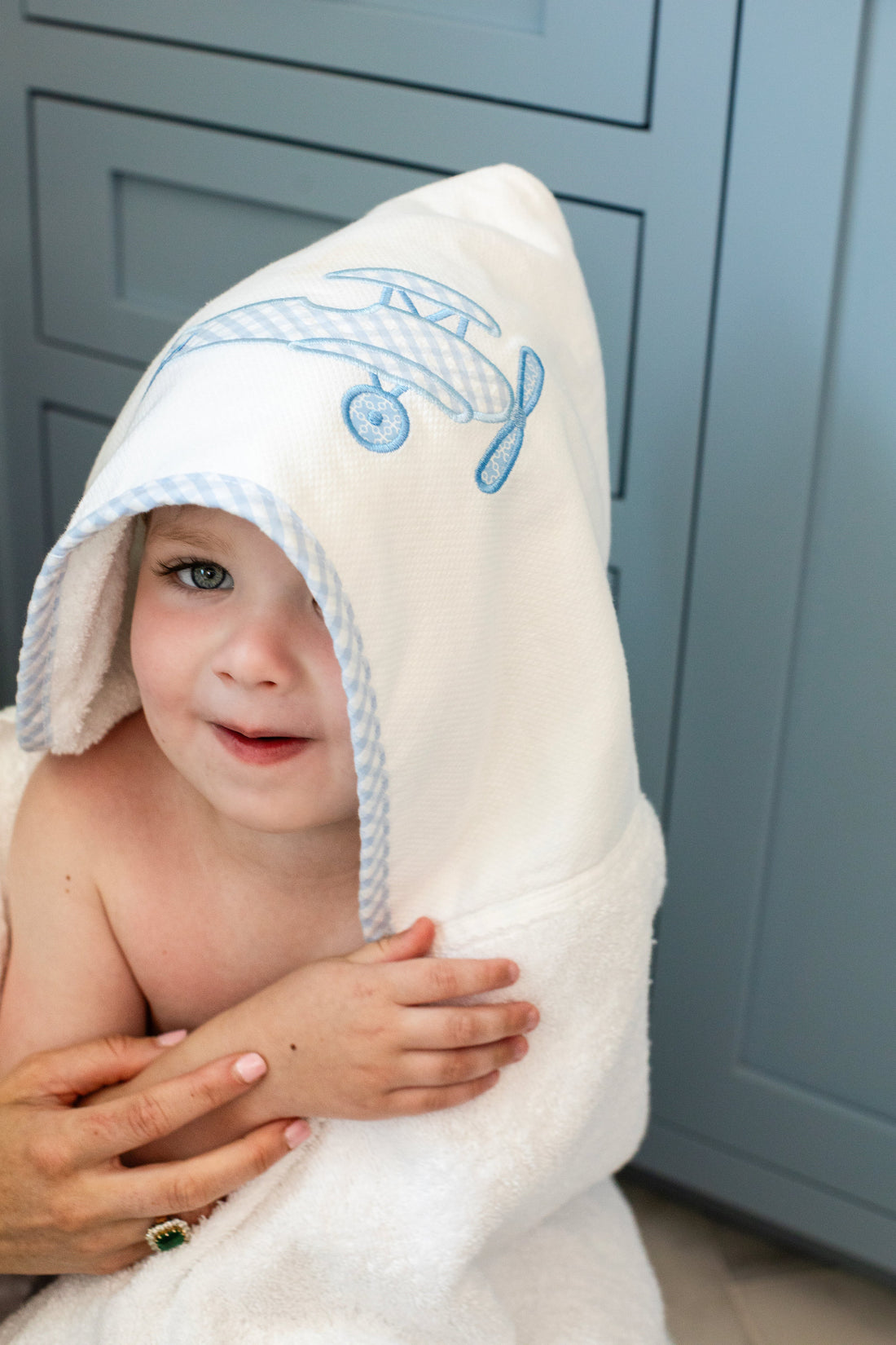 3 Marthas white hooded terrycloth towel with blue airplane applique and blue big check trim for boys