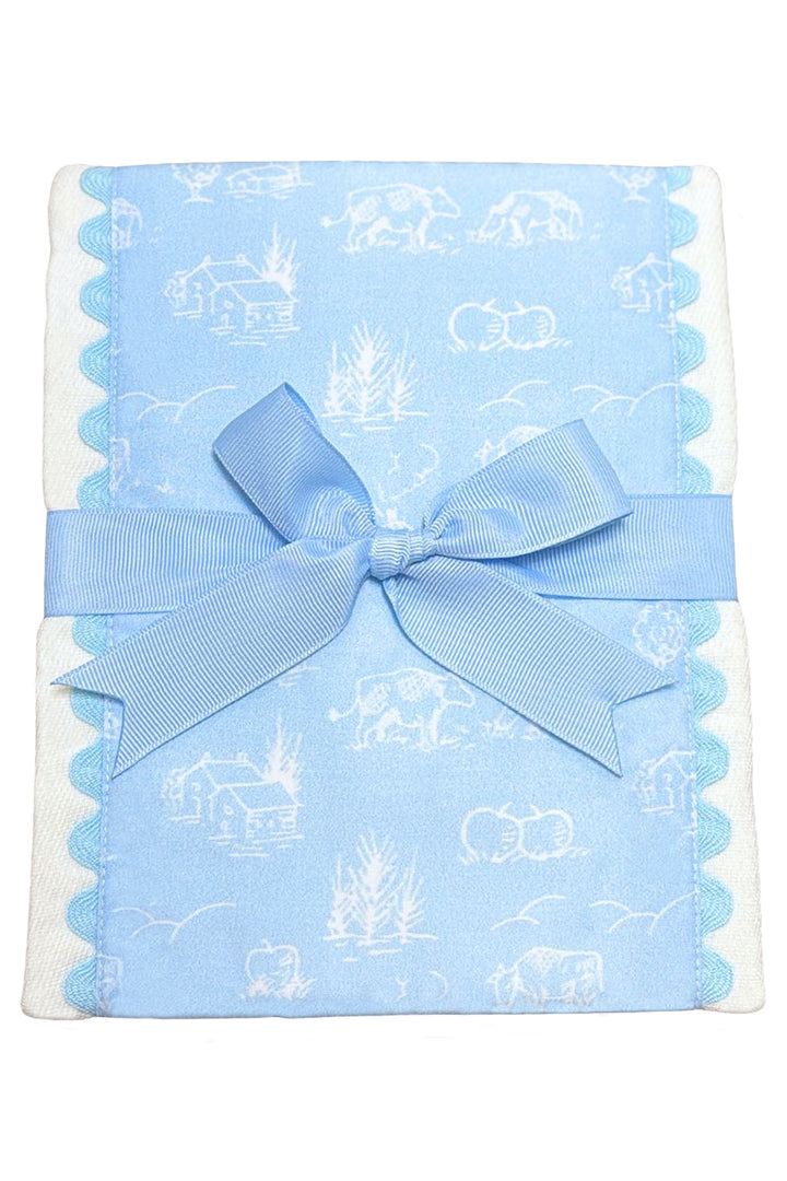 Blue burp cloth with cow and farm pattern and a blue bow, 3 Marthas