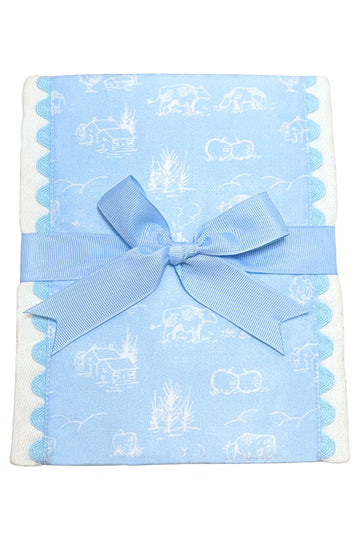 Blue burp cloth with cow and farm pattern and a blue bow, 3 Marthas