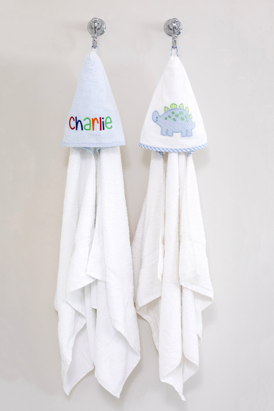 3 Marthas white terrycloth hooded towel with blue and green applique dino and blue check trim for boys. White terrycloth hooded towel with blue seersucker stripes for boys. 
