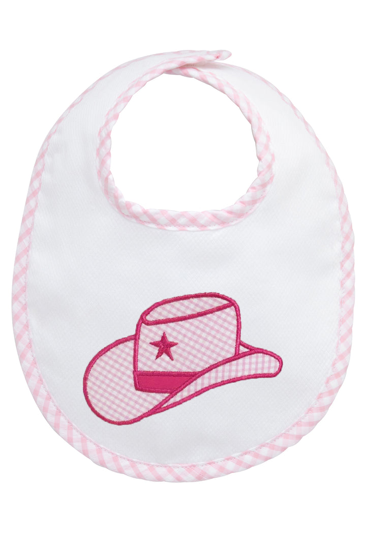 Baby bib with pink cowgirl hat design on a white background