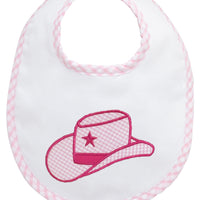 Baby bib with pink cowgirl hat design on a white background