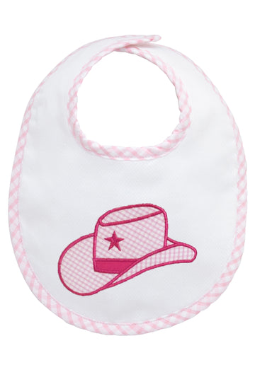 Baby bib with pink cowgirl hat design on a white background