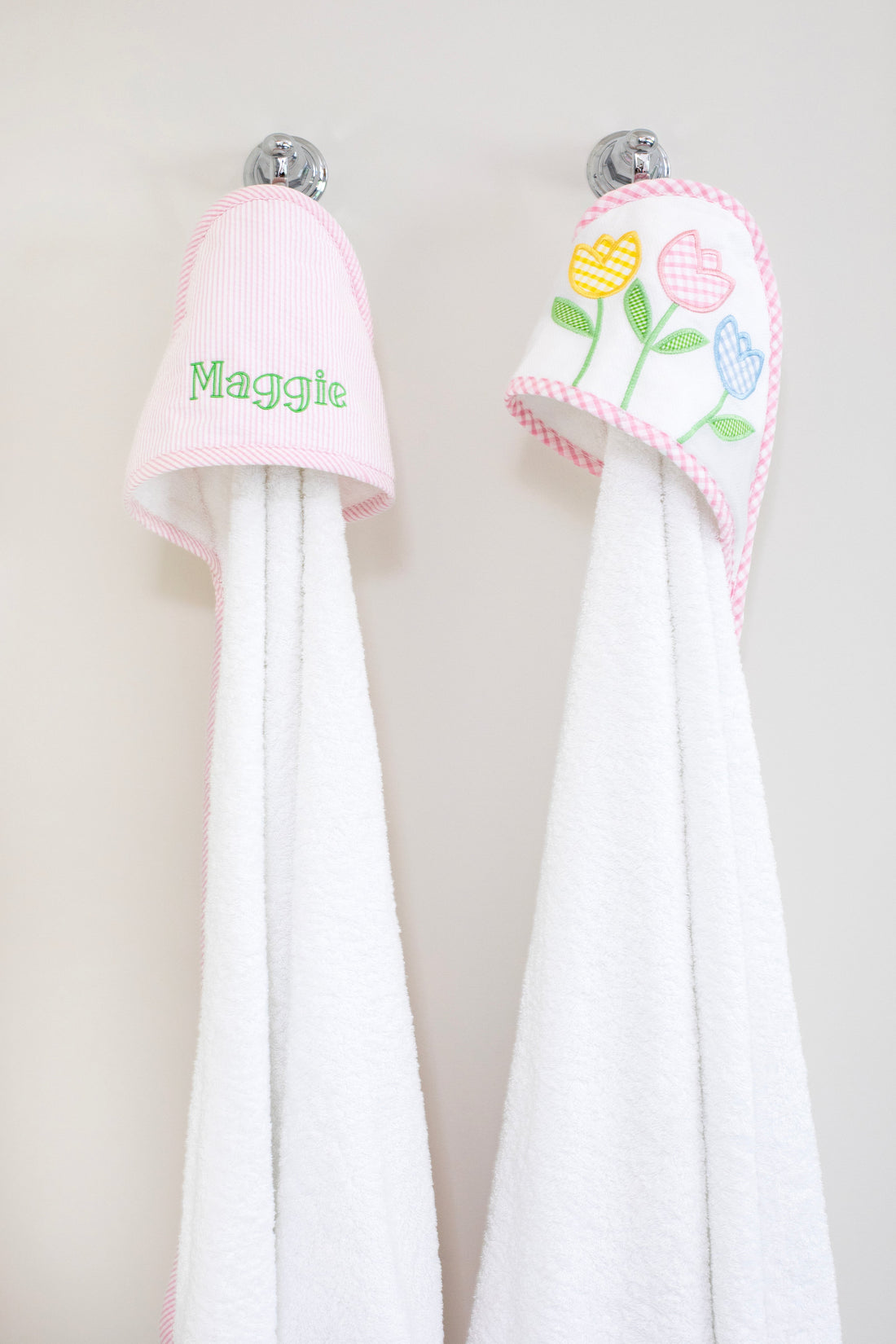 3 Marthas white terrycloth hooded towel with pink seersucker hood with pink trim for girls. White terrycloth hooded towel with multicolor tulip applique with pink trim for girls. 