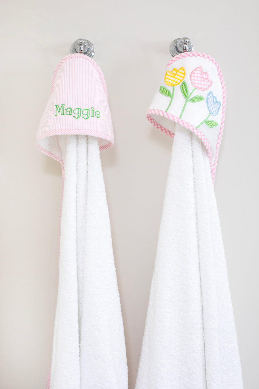 3 Marthas white terrycloth hooded towel with pink seersucker hood with pink trim for girls. White terrycloth hooded towel with multicolor tulip applique with pink trim for girls. 