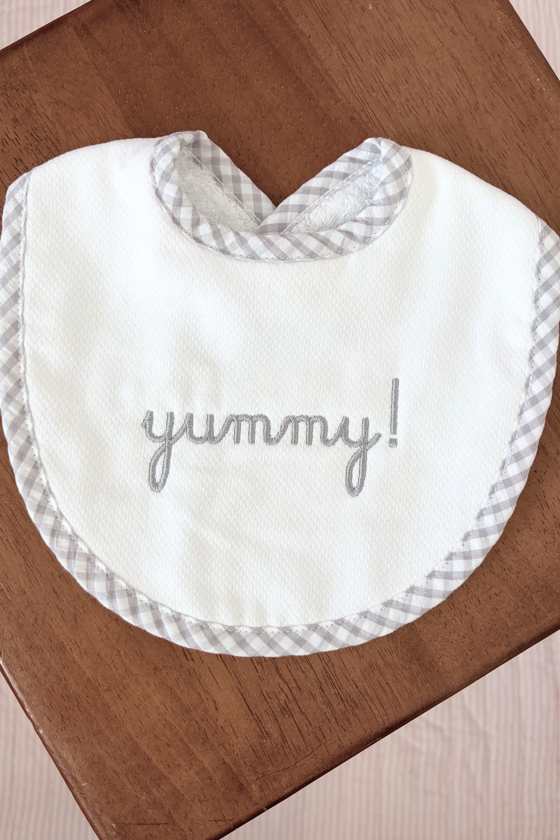 White bib with &
